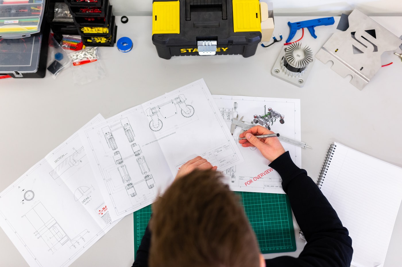 KLOQ engineer reviewing system drawings